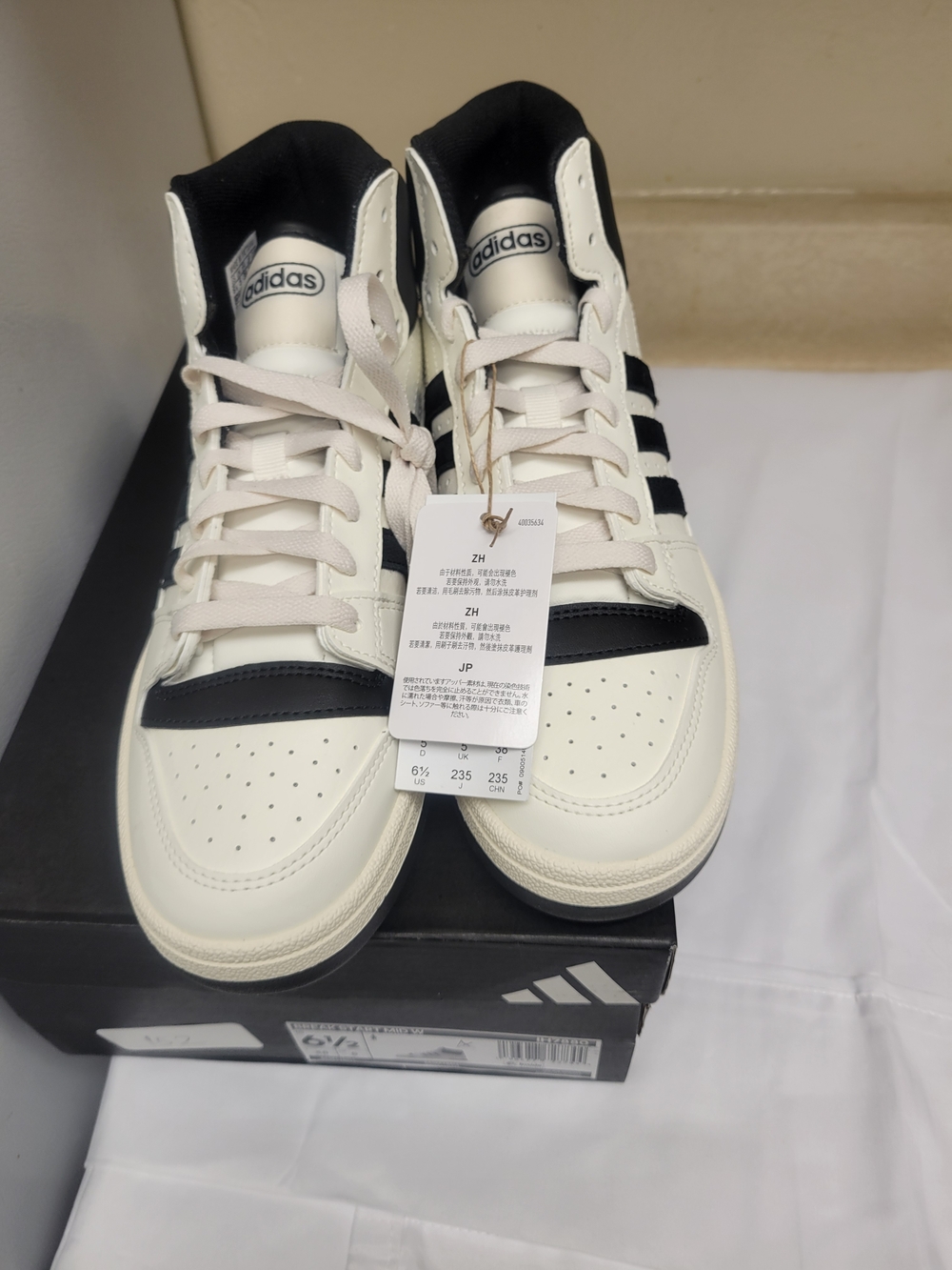 Adidas Men's White and Black High-Top Sneakers